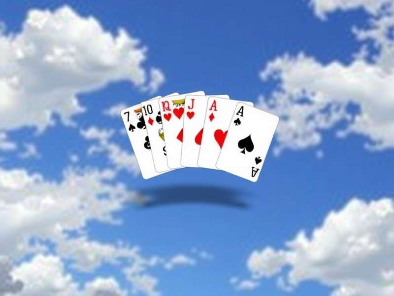 Microsoft Klondike Solitaire game interface on a laptop with playing cards visible