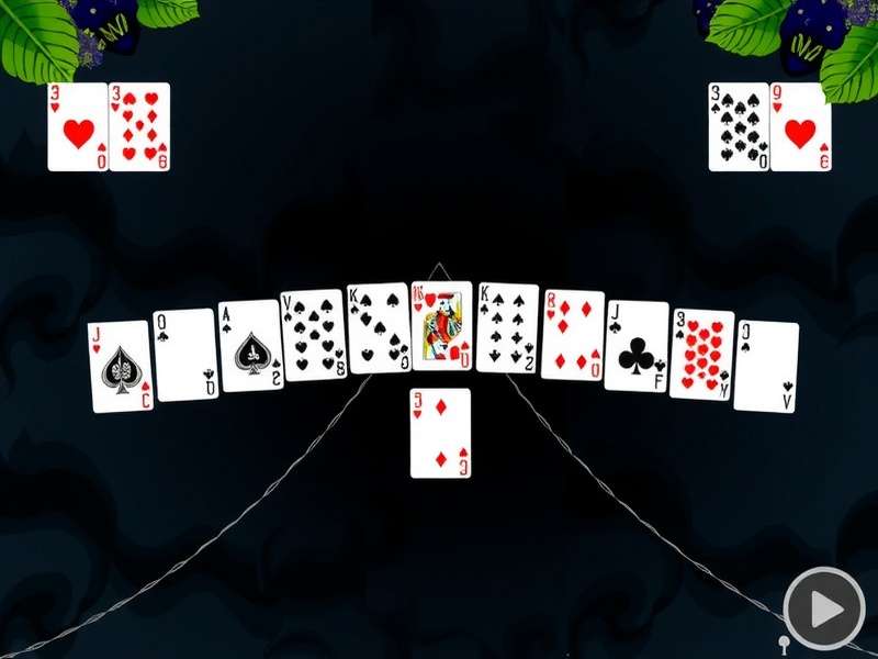 Strategic close-up of a hand arranging cards in a game of Spider Solitaire