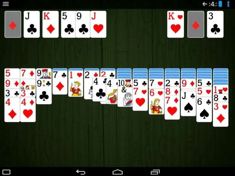 Classic Klondike Solitaire cards laid out on green felt