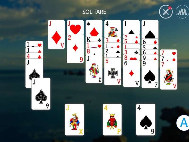 A close-up view of a complex Spider Solitaire game layout in progress on a digital device, showing sequenced cards and potential moves.